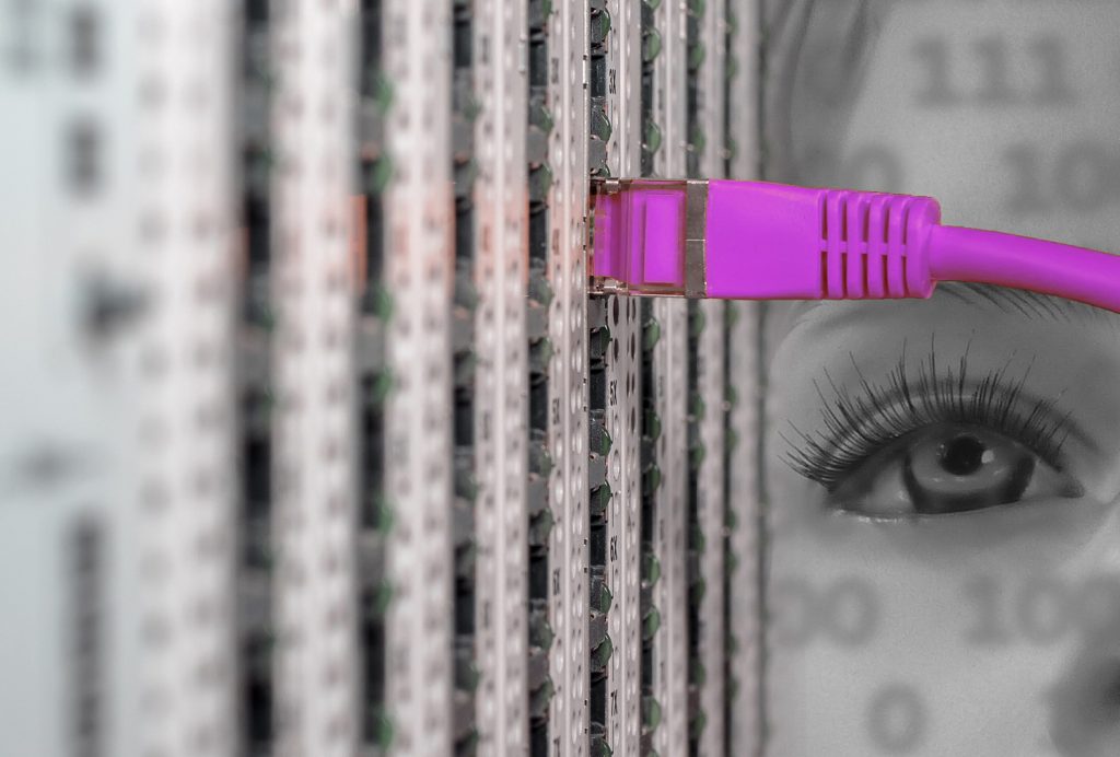 Debian 11 is excellent operating system for your VPS. Woman watching pink network cable.